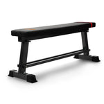 Black flat weight bench with sturdy steel frame for home or gym workouts