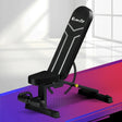 Black adjustable Everfit workout bench with padded seat and backrest on colorful gym floor