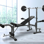 Adjustable weight bench with barbell and leg curl attachments in a bright home gym