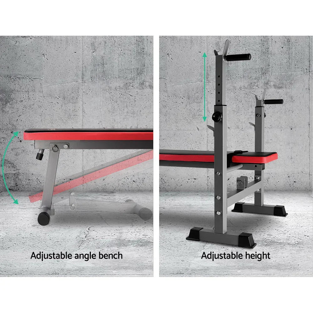 Adjustable workout bench with red padding and height settings on gray concrete background