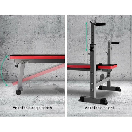 Adjustable workout bench with red padding and height settings on gray concrete background