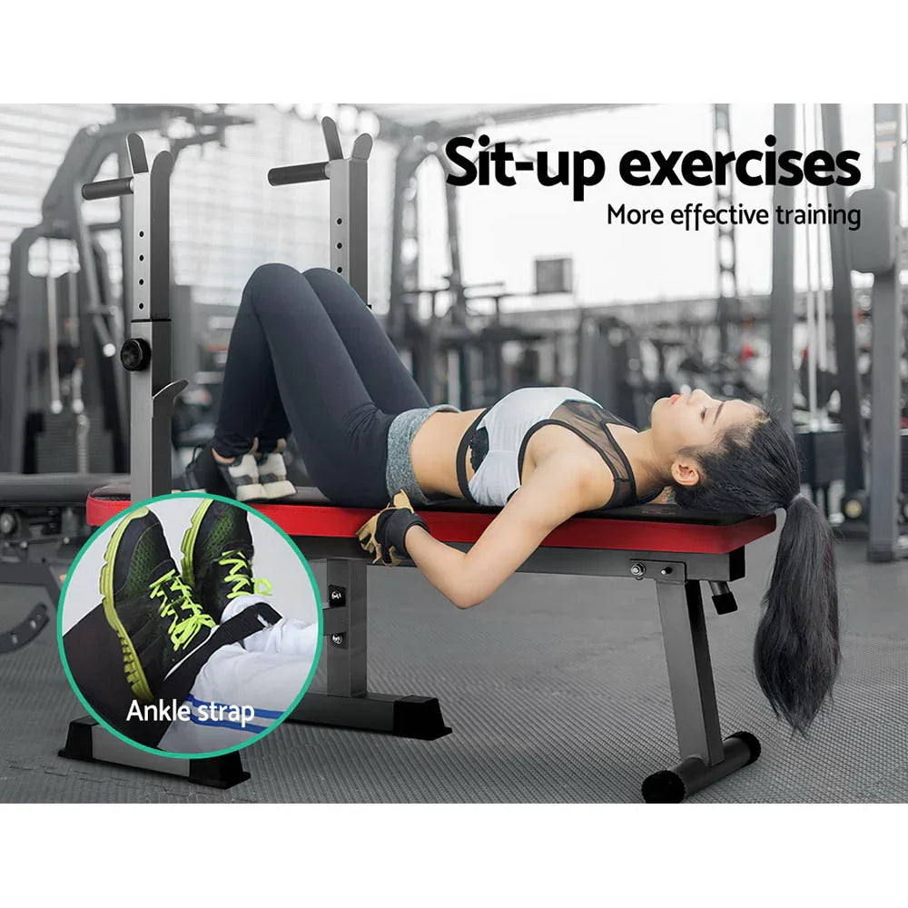 Woman performing sit-up exercises on red gym bench with ankle strap in fitness center