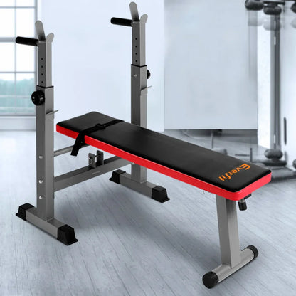 Adjustable weight bench with black cushion and red trim in home gym setting
