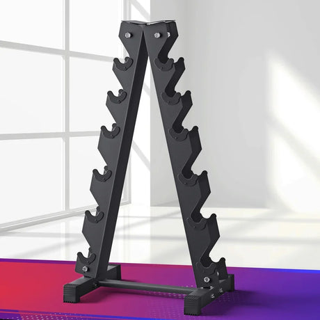 Black metal A-frame dumbbell rack with six pairs of angled slots on each side in a bright gym room