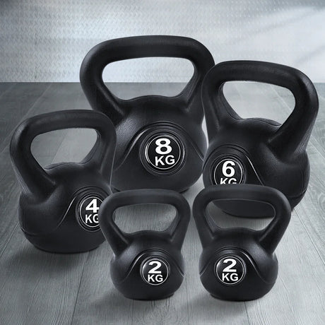 Set of black kettlebells weighing 2kg, 4kg, 6kg, and 8kg on a wood floor