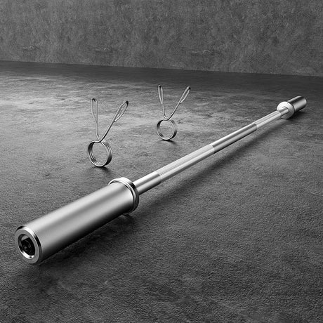 Olympic barbell with two spring collars on textured gym floor