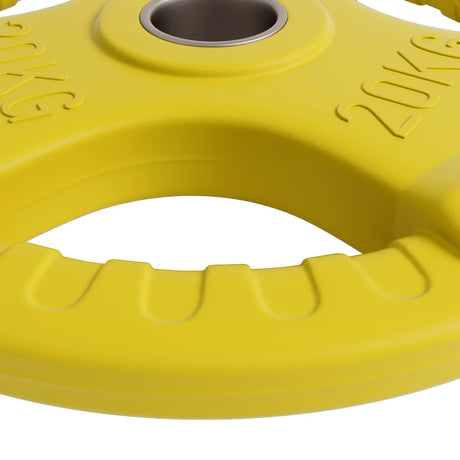 Close-up of bright yellow 20kg weightlifting plate with grip holes and metal center ring