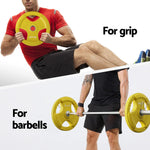 Man exercising with yellow 20kg Everfit weight plate for grip and barbell workout