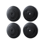 Set of two black 5kg and two 10kg weight plates for barbells isolated on white background