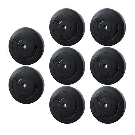 Eight black 10kg weight plates for gym fitness training with central holes