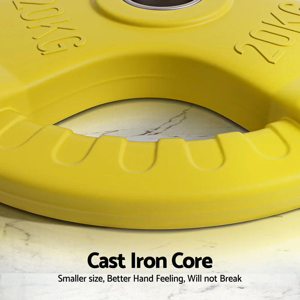 Yellow 20kg weight plate with cast iron core on marble surface, fitness equipment detail