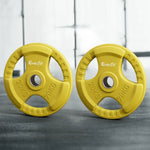 Two yellow Everfit 20kg weight plates standing on a gym floor with blurred window background