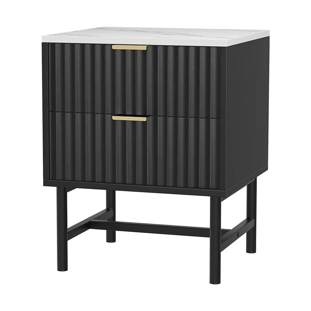 Modern black nightstand with ribbed drawers, gold handles, and a white marble top