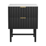 Modern black nightstand with fluted drawers, gold handles, and white marble top