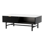 Modern black and white coffee table with ribbed drawer and open shelf on metal legs