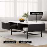 Modern black and white coffee table with open drawer, storage shelf, and 50kg capacity label