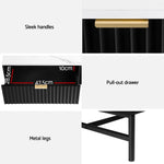 Black nightstand with gold handles, pull-out drawer, metal legs, and drawer dimensions.