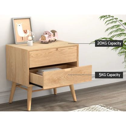 Light wood bedside table with two drawers, 20kg top and 5kg drawer capacity, decor on top