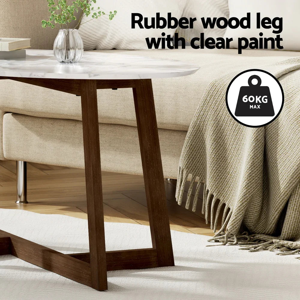 Marble top coffee table with rubber wood legs in modern living room, 60kg max weight.