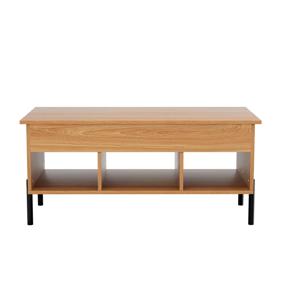 Modern coffee table with light wood finish, three open storage cubbies, and black legs