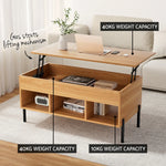 Light wood lift top coffee table with storage shelves, gas struts, and weight capacity labels in living room