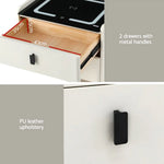 White nightstand with PU leather upholstery, two drawers, black metal handles, and drawer dimensions.