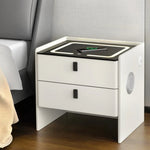 Modern white nightstand with drawers, LED lights, wireless charging and speaker, next to bed