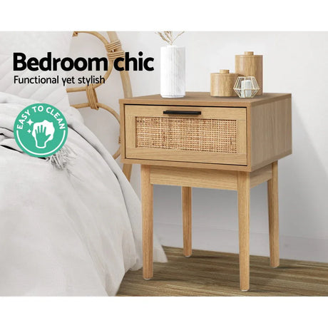 Modern wooden bedside table with rattan drawer and decor in a stylish bedroom, easy to clean