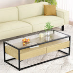 Modern glass top coffee table with wood drawers and black metal frame in living room