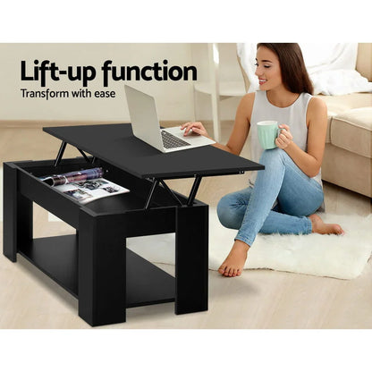 Woman using black lift-up coffee table desk with laptop in modern living room