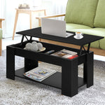Modern black lift-top coffee table with laptop and cup in a bright living room