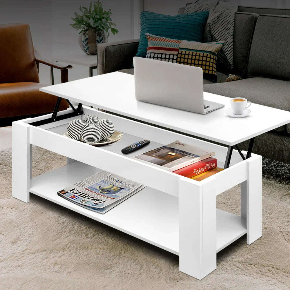 White lift-top coffee table with storage, laptop, cup, and modern living room decor