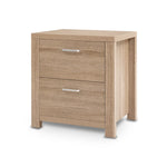 Modern light oak nightstand with two drawers and silver handles on white background