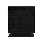 Modern black three-drawer nightstand with glossy finish on white background