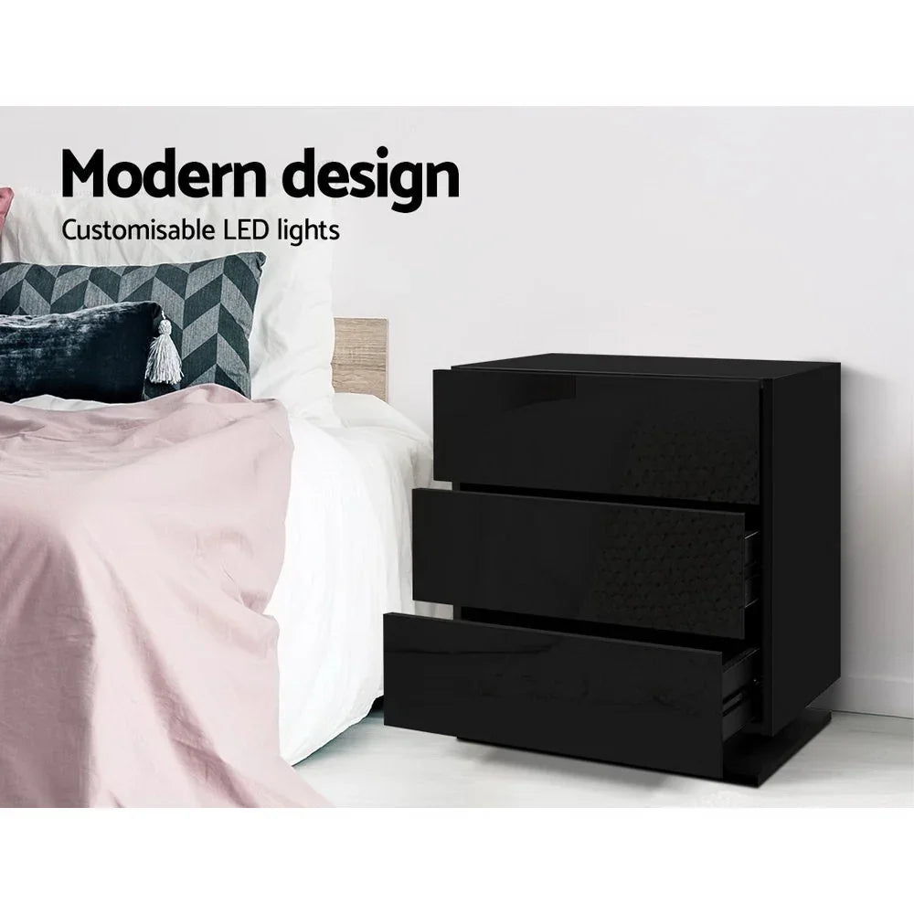 Black modern bedside table with glossy finish and customisable LED lights next to bed
