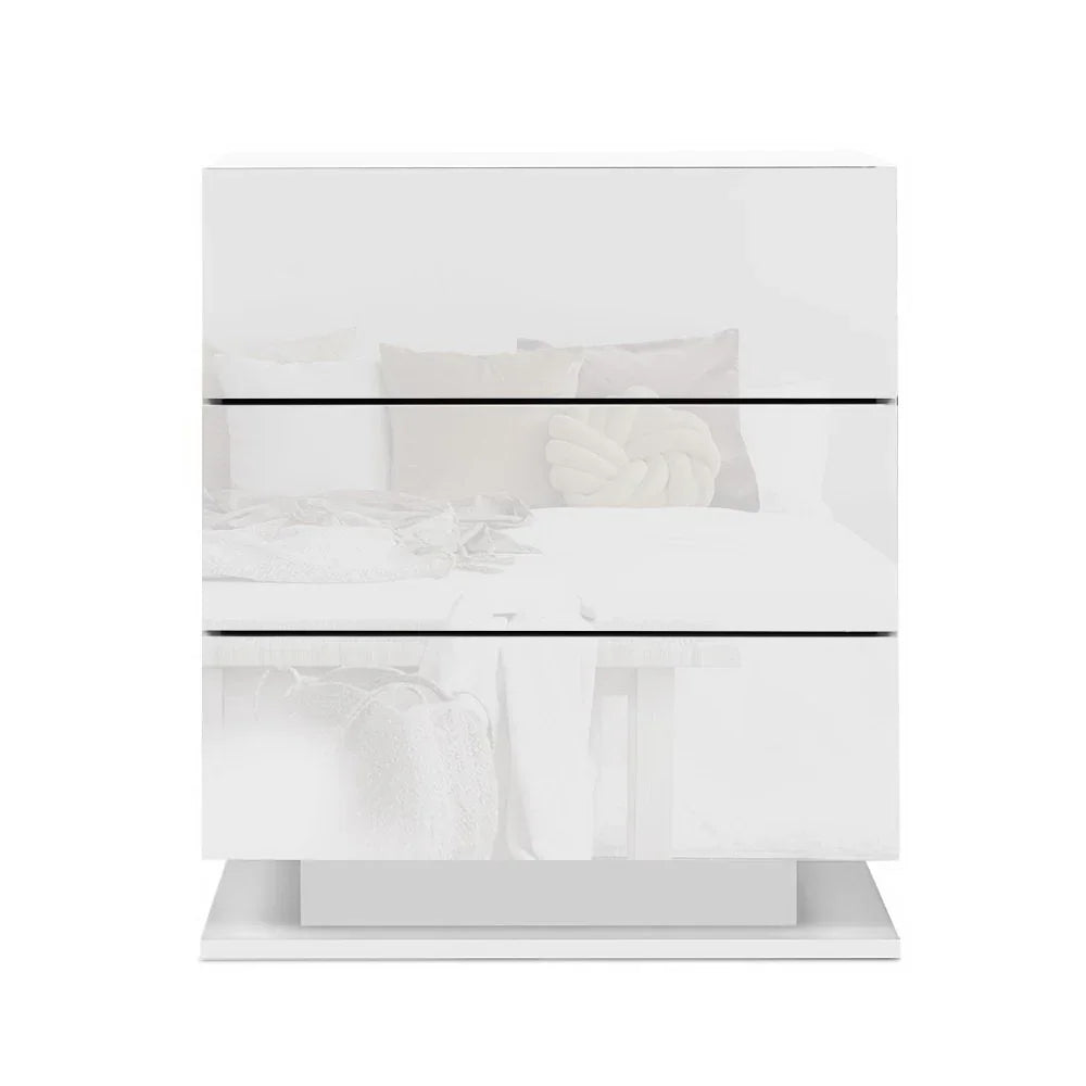 Modern white high gloss bedside table with three drawers on white background