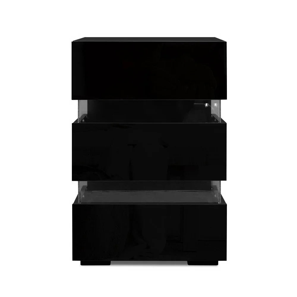 Modern black bedside table with three glossy drawers and clear acrylic spacers