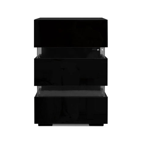 Modern black bedside table with three glossy drawers and clear acrylic spacers