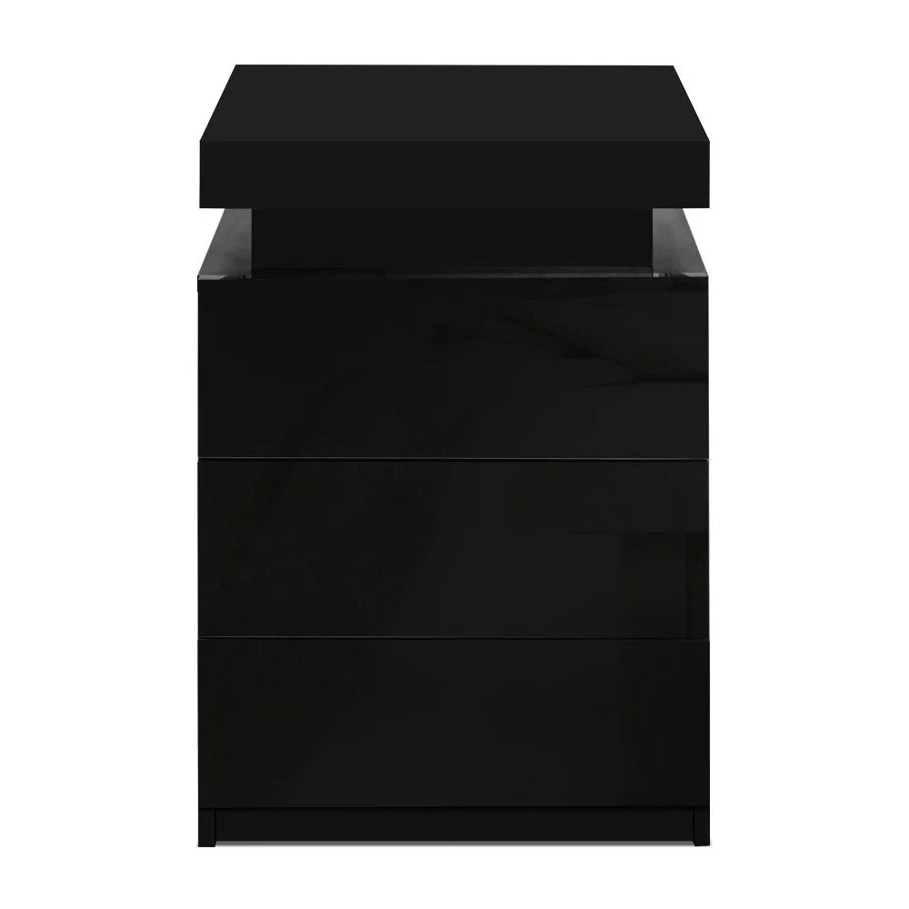 Modern black three-drawer nightstand with a glossy finish on a white background