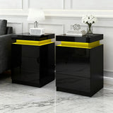 Modern black nightstands with yellow LED lights in a stylish living room setting