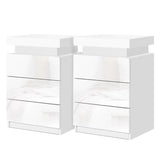 Set of two modern white high gloss LED bedside tables with three drawers