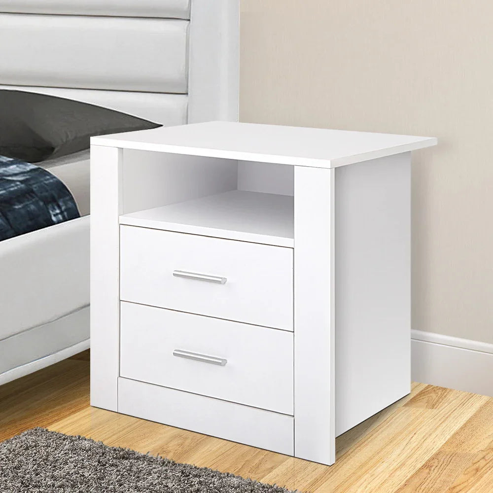 Modern white bedside table with two drawers and open shelf in a bedroom