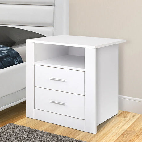 Modern white bedside table with two drawers and open shelf in a bedroom