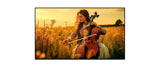 Woman playing cello in a golden field at sunset displayed on a TV screen, Flea Market deal