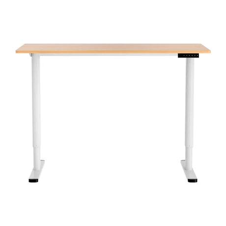 Modern adjustable standing desk with light wood top and white metal legs and control panel
