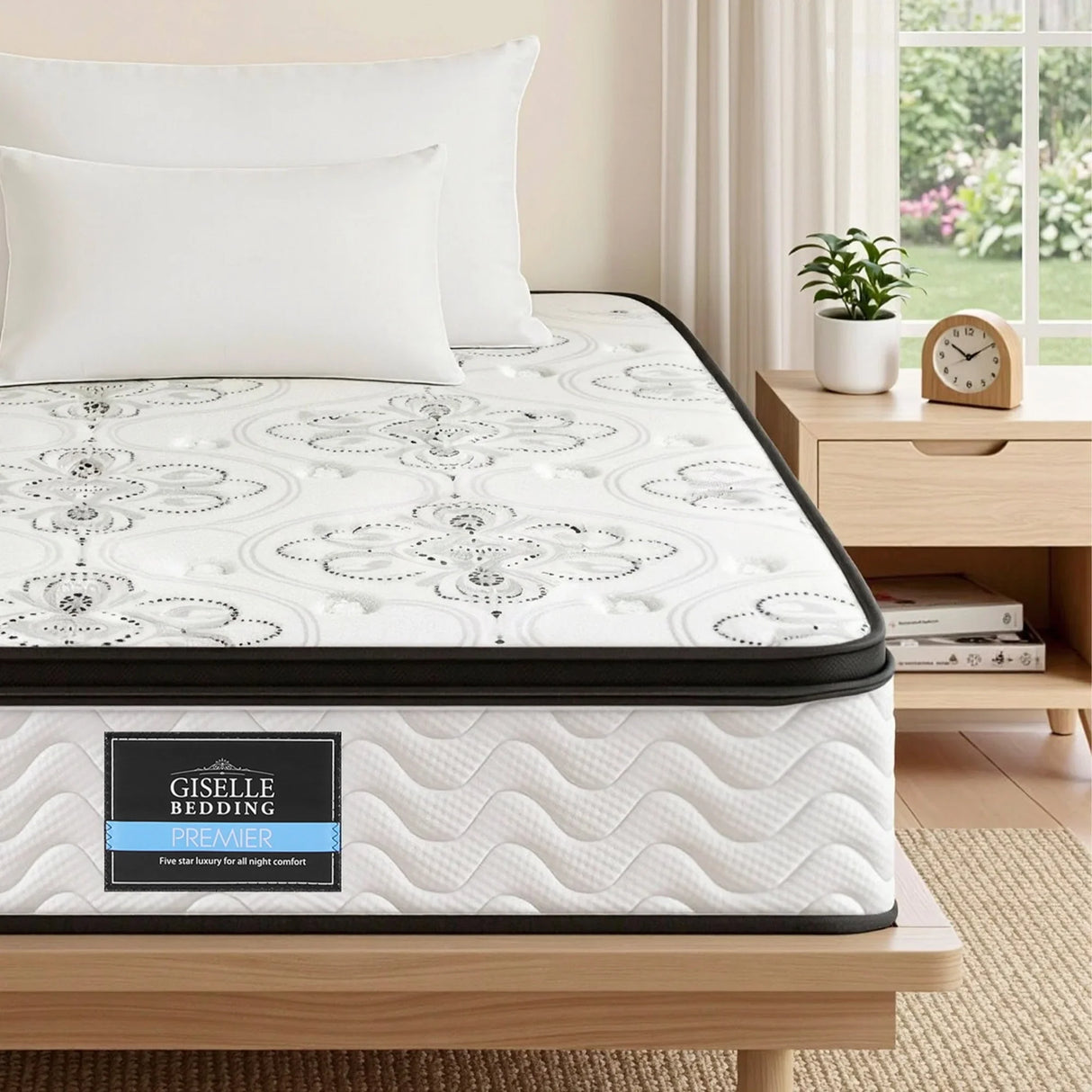 Giselle Bedding Premier mattress on timber bed with pillows, bedside table, and indoor plant