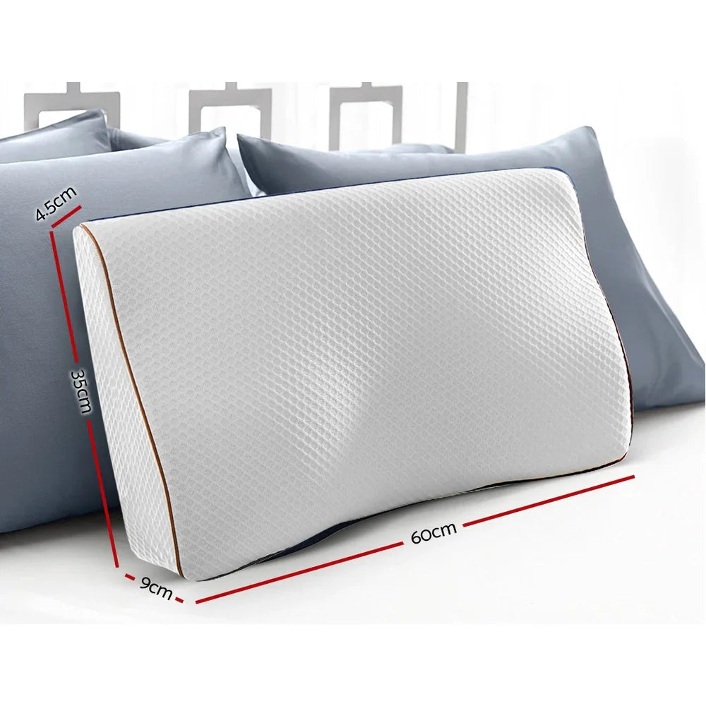 White ergonomic memory foam pillow with textured cover, showing dimensions, placed on blue cushions