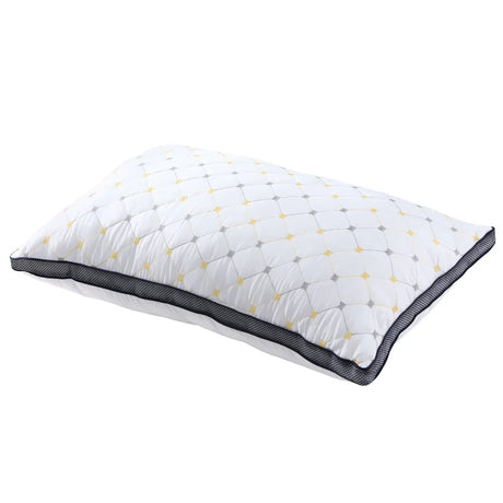 White quilted pillow with yellow and gray diamond pattern and black mesh border
