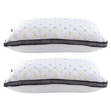 Two white pillows with black mesh trim and yellow-gray diamond pattern stacked side by side