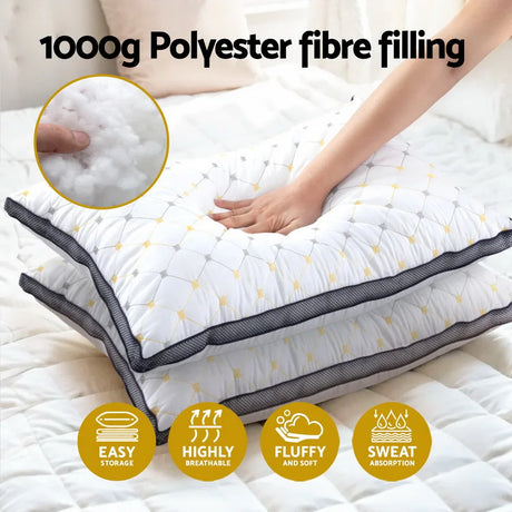 Hand pressing on white polyester fiber-filled pillow with quilted pattern, showing softness and breathability